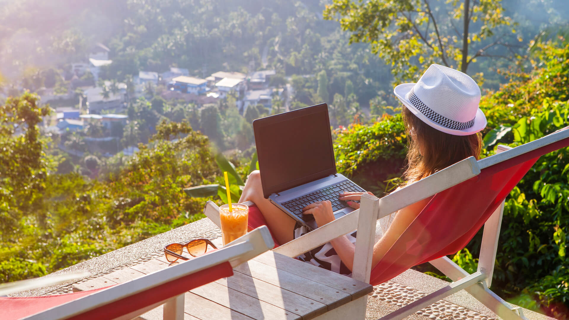 Digital nomad girl making billions on her laptop.